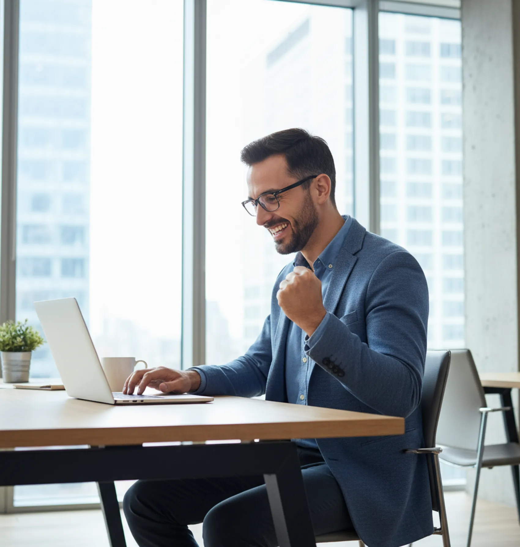 Professional using laptop with credit card benefits